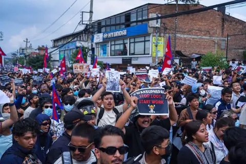 Getty Images Thousands of youth protesting against the social media ban 