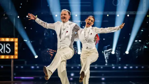 Chris McCausland and Dianne Buswell danicng in the Strictly live show last year