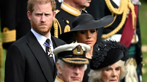Reuters  Duchess of Sussex, reacts as she, Prince Harry, Duke of Sussex, Queen Camilla and King Charles attend the state funeral and burial of Britain's Queen Elizabeth, in London, Britain, September 19, 2022