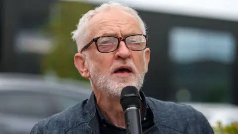 Getty Images Jeremy Corbyn speaks into a microphone.