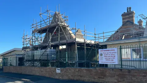 BBC Manorbier VC School building with scaffolding visible, along with damage including a missing roof