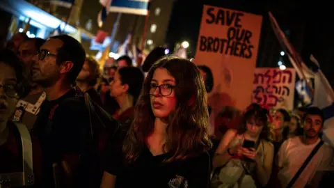 Getty Images A woman attends a demonstration in Jerusalem organised by the families of the Israeli hostages in Gaza.