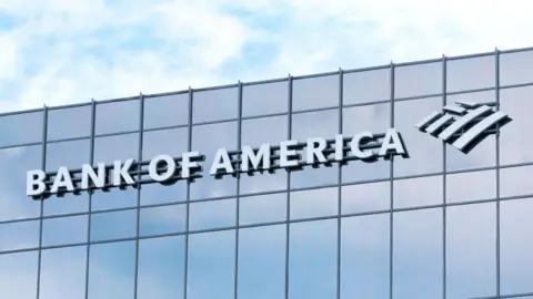 AFP via Getty Images Bank of america written across a glass building with its logo