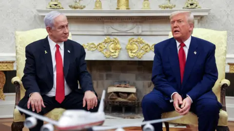 Reuters US President Donald Trump talks to Israeli Prime Minister Benjamin Netanyahu during a meeting where Trump announced nuclear talks with Iran