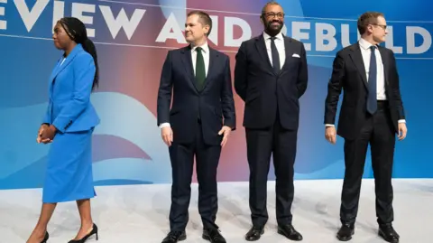 PA Media Kemi Badenoch, Robert Jenrick, James Cleverly and Tom Tugendhat on stage in Birmingham in 2024