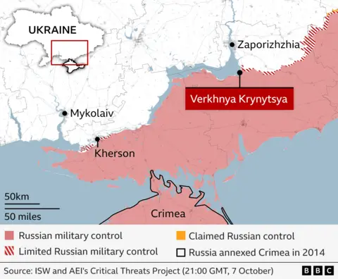 Map of southern Ukraine as of October 7, showing areas under Russian military control in red, limited control in red and white stripes , and claimed control in yellow. The village of Verkhnya Krynytsya on the front line is highlighted, and further south west the city of Kherson, also on the front line, is also labelled. Mykolaiv, to the north west of Kherson, and Zaporizhzhia, north of Verkhnya Krynytsya, are both labelled in the area of Ukraine not under any level of Russian control