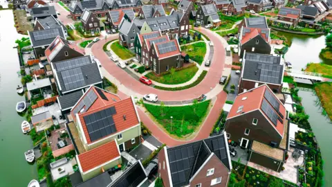 AFP via Getty Images Dutch homes covered in solar panels