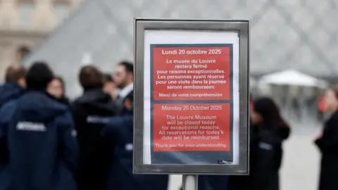 Reuters A placard which reads "The Louvre Museum will be closed today for exceptional reasons" in English and French situated near the glass Pyramid of the Louvre Museum.