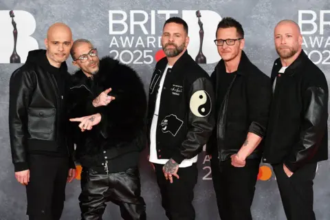 Getty Five at the Brit Awards 2025, they are all wearing black outfits.