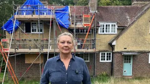 BBC The Chilworth home of Emma Wills after a modified e-bike caused a fire which destroyed much of the property. 