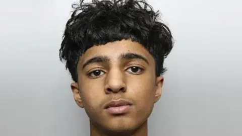South Yorkshire Police A police image of a 15-year-old boy with black hair. 