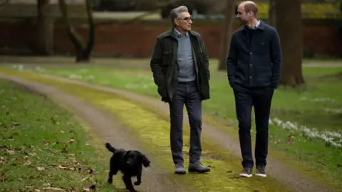 AppleTV+/PA Eugene Levy, Prince William and his dog walking in the park