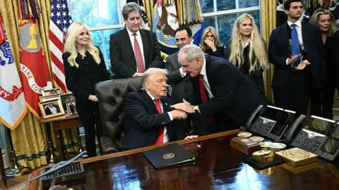BRENDAN SMIALOWSKI/AFP US President Donald Trump shakes hands with US Senator James Risch, Republican from Idaho during a swearing-in ceremony 