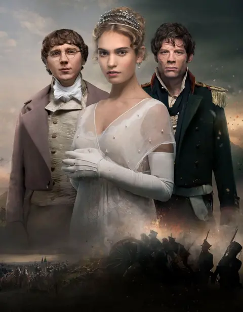 Two men and a woman in 19th century Russian period dress stare at the camera.