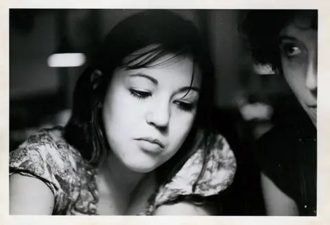 Family handout A black-and-white picture of a young Mariona, a girl with dark hair looking down