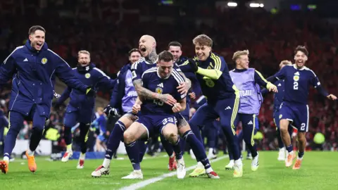 SNS Kenny McLean celebrating with the Scotland players at the end of the match.