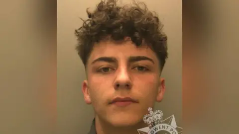 Gwent Police A mugshot photo of a man with brown hair
