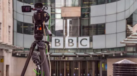 Vuk Valcic/SOPA Images/LightRocket via Getty Images The front of the BBC's New Broadcasting House - a television camera can be seen, on a tripod 