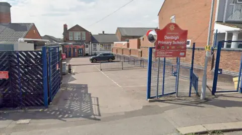 Google The gates outside Denbigh Primary School in Luton.