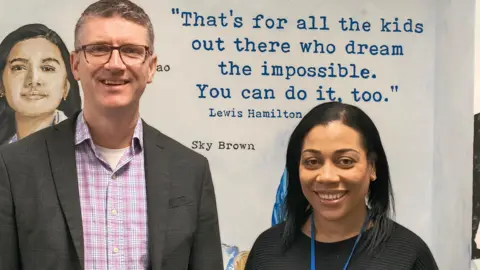 Netley Primary school Netley Primary School head Gareth Morris with Family and Children's Champion Simone Sarosh-Cambridge