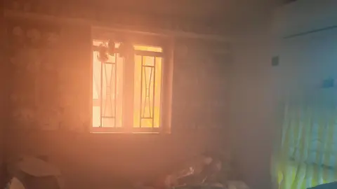 William Li A shelf full of Chiikawa toys in William Li's smoked-filled room 