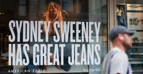 Getty Images A window display of actress Sydney Sweeney is seen on the front of an American Eagle store on 1 August, 2025, in New York City. 