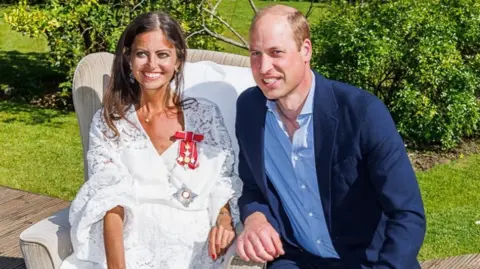 Deborah James The podcaster and cancer campaigner Dame Deborah James is pictured in her family's garden with Prince William who conferred her damehood in person in May 2022.