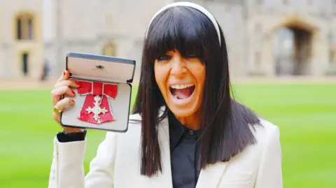 PA Media Claudia Winkleman after being made a Member of the Order of the British Empire by King Charles III during an Investiture ceremony at Windsor Castle, Berkshire. Picture date: Tuesday December 9, 2025.