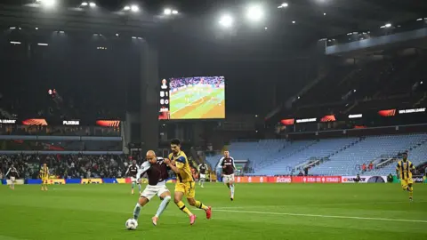 Getty Images Photo of the match taking place in the Aston Villa stadium with empty stands seen in the background
