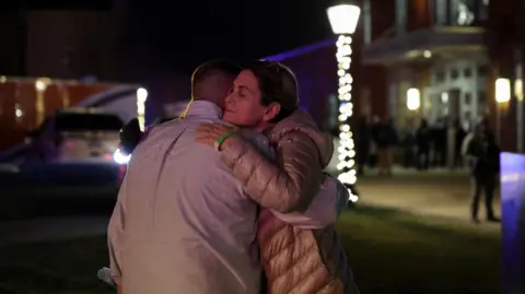 Reuters People hug outside the Nelson Fitness Center after Brown University was locked down amid reports of a shooting on campus in Providence, Rhode Island.