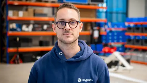 Ceo of Skyports Drone Services is pictured inside the hanger where the company stores its drones