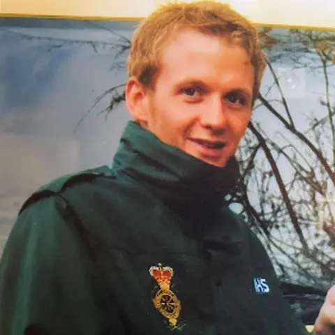 Joan Scourfield This photo shows James wearing a green ambulance uniform