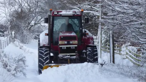 BBC Weather Watchers / Swinny A tractor is seen in thick snow