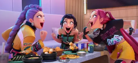 Netflix A still from KPop Demon Hunters, showing the girlband in a restaurant