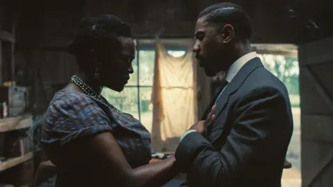 Warner Bros Wunmi Mosaku and Michael B Jordan in Sinners