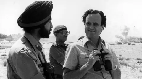 Mark Tully with members of the Indian armed forces. 