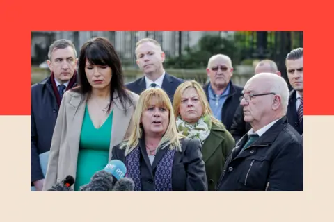 PA Wire Troubles victim Martina Dillon (centre) speaks to the media outside Belfast High Court 