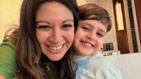 Other Tiya and her son Arun smiling at the camera