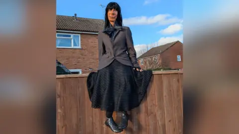 Sharon Kulesa An effigy of Claudia Winkleman sitting on a garden fence.