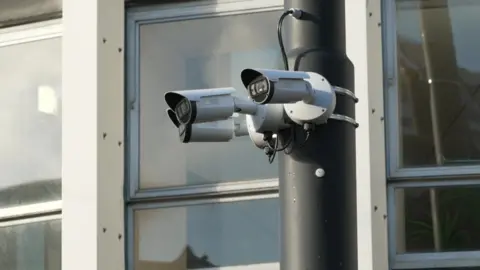 BBC Three cameras are mounted on a street lamp 