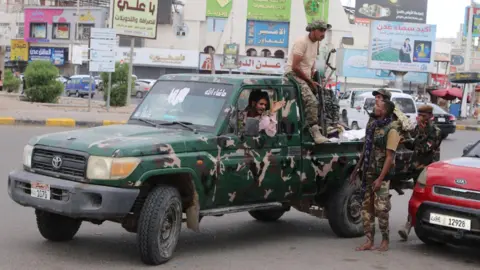 Reuters Police forces patrol a street in Aden, southern Yemen (7 January 2026)
