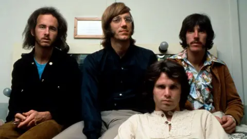 Getty Images Photo of US rock group The Doors. Shows four men in late '60s/early '70s' garb, all sporting long hair.